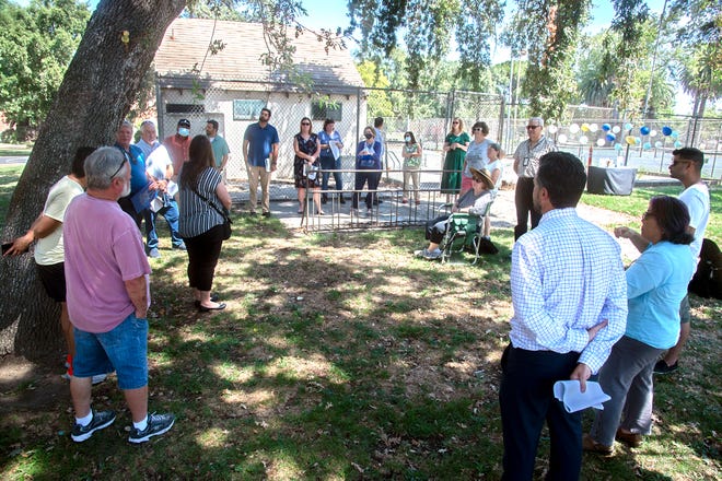 Area residents discuss the renovation of the swimming pool at Victory Park in Stockton.