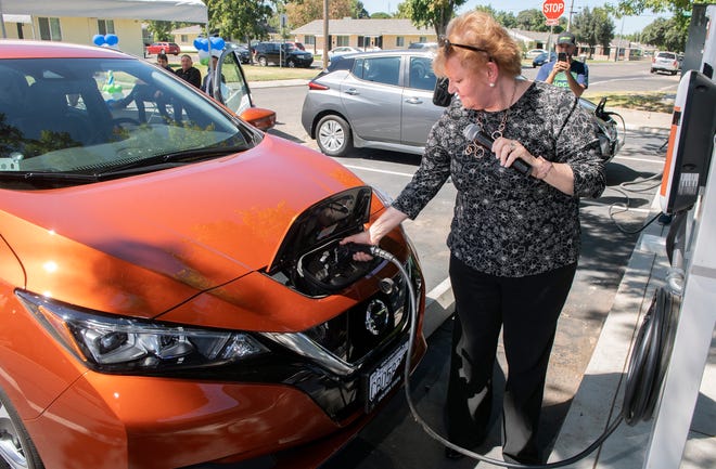 Housing Authority of San Joaquin consultant Sandy Paben demonstrates how to use a Nissan Leaf electric vehicle at the E-Carshare preview event at Conway Homes in south Stockton on Thursday, August, 25, 2022.