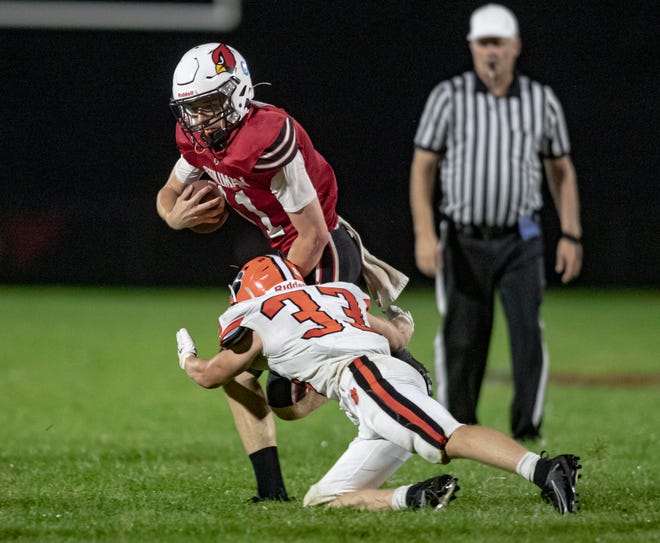 Stillman Valley's Braden Engel gets hit by Byron's Carsen Behn on Friday, Aug. 26, 2022, at Stillman Valley High School in Stillman Valley.
