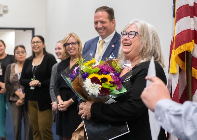 San Joaquin County Office of Education Assistant Superintendent of Education Services Jane Steinkamp, ​​right, is surprised with the announcement that she is the recipient of the 2022 ATHENA Award.  Steinkamp was leading a teachers workshop at the SJCOE when she got news of the honor.