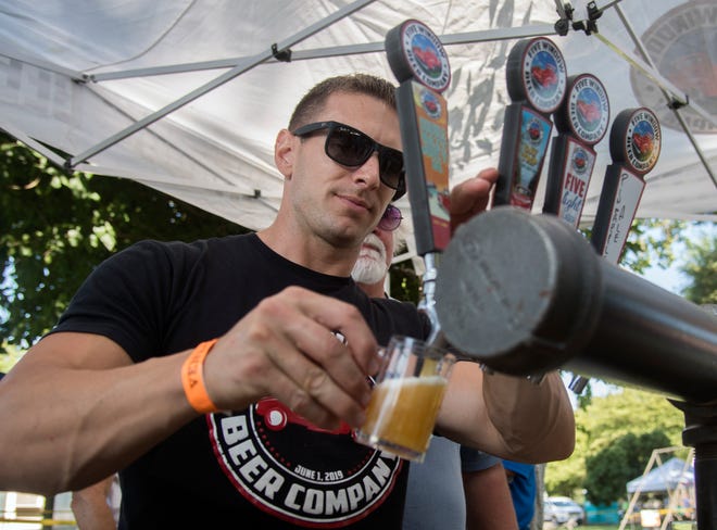 Charlie Lippert with the Lodi-based Five Windows Beer Company pours a beer at the annual Stockton Brew Fest in east Stockton.  The 6th Annual Stockton Brew Fest will be Saturday, Sept. 10.