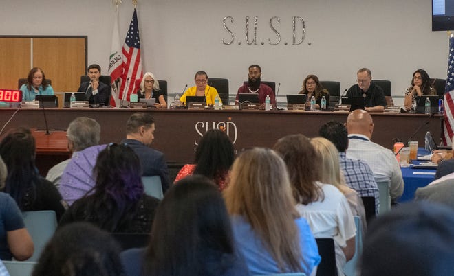 The Stockton Unified School District board approves the board's response to the San Joaquin County grand jury report during a regular board meeting at the districts headquarters in downtown Stockton on Aug. 23.