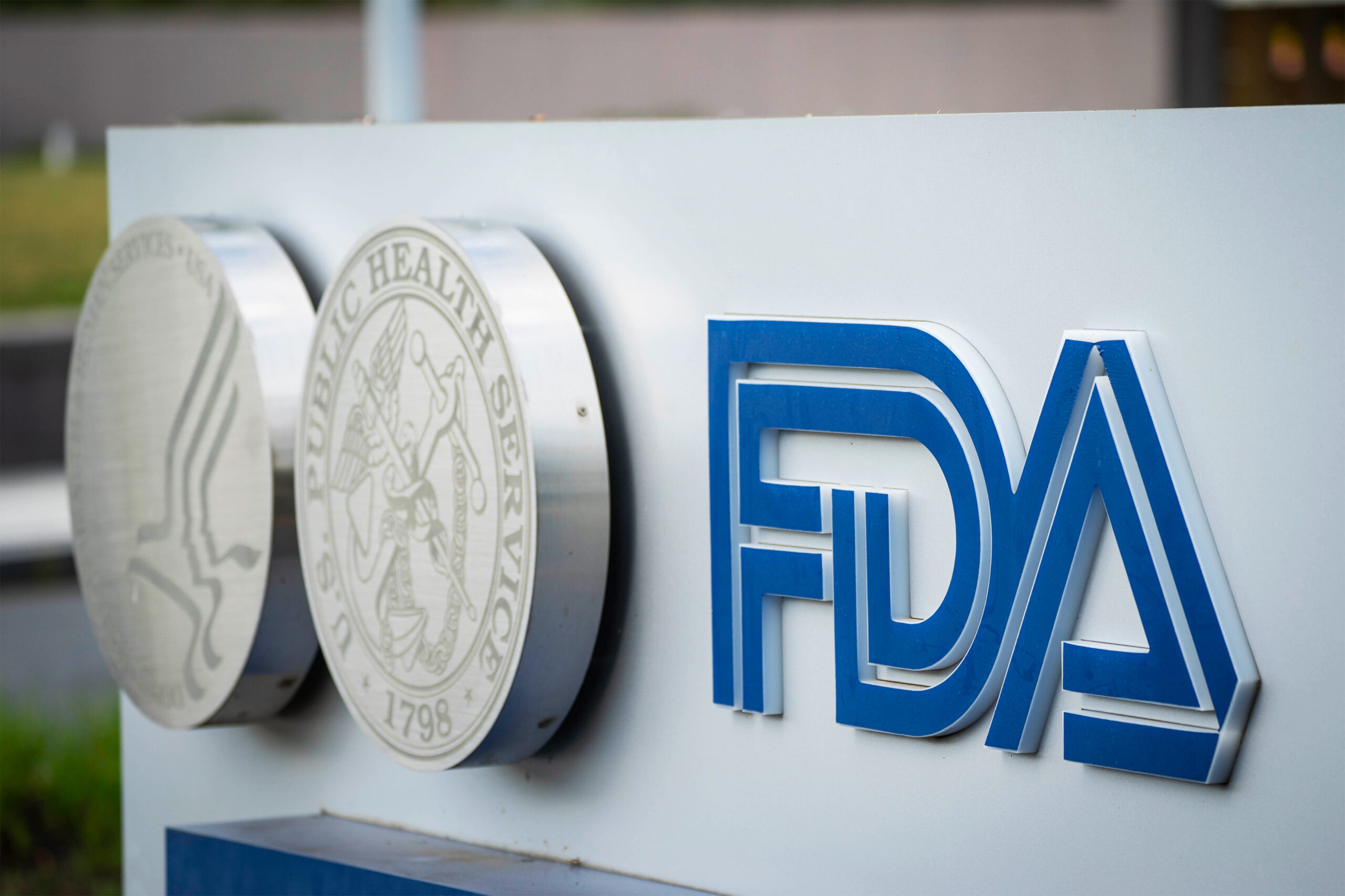 A photo shows a sign outside the FDA's headquarters.