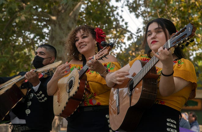 Members of the Mariachi Bonitas band perform at the Lodi Arts Commission's 10th annual Taco Truck Cook Off at Hale Park in Lodi.