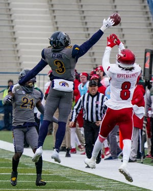 Kent State safety Dean Clark makes an athletic play to break up a pass to Miami's Mac Hippenhammer at Dix Stadium in a 2021 game.